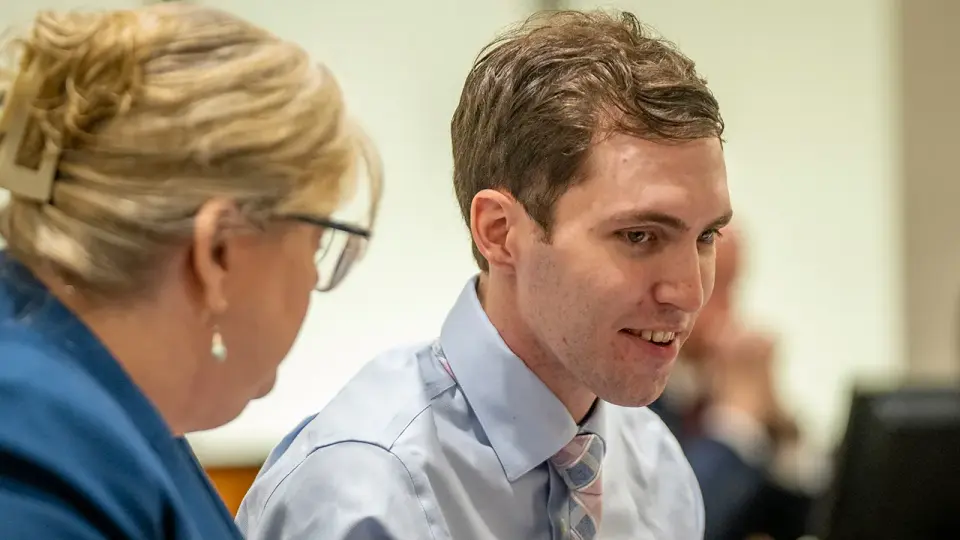 Man accused of targeting Charlie Kirk shows distress during court hearing