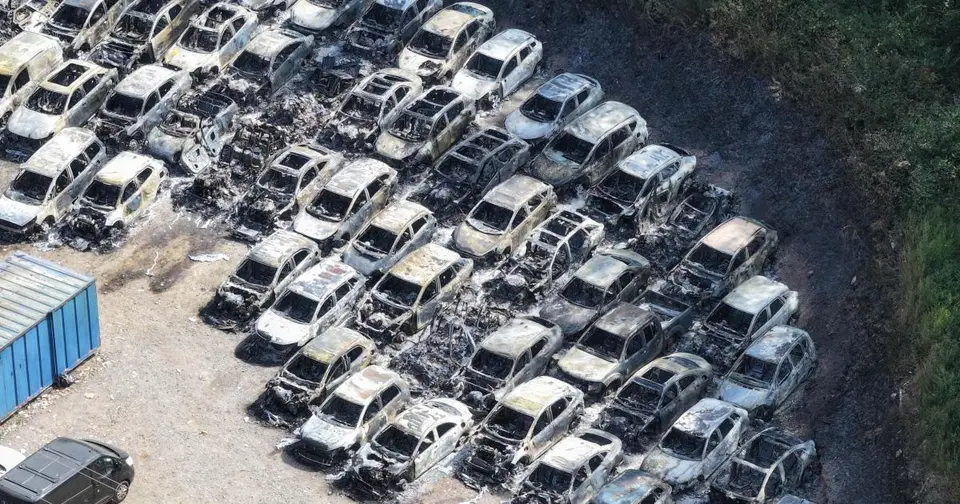 Two men arrested over arson at Gatwick car park fire destroying 140 vehicles