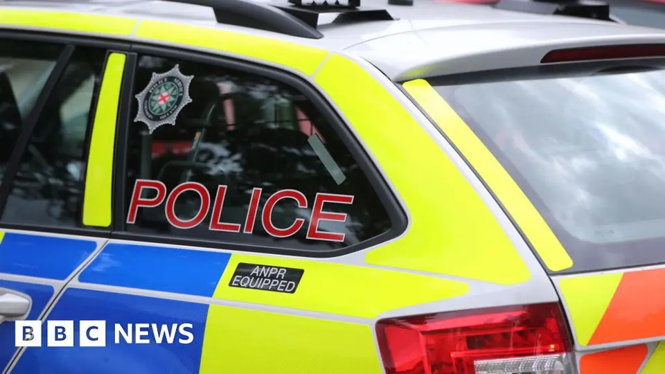 Two men charged after PSNI patrol car rammed on Glen Road, West Belfast