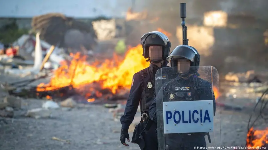 Protesters torch migrant camp in Ceuta, clash with police