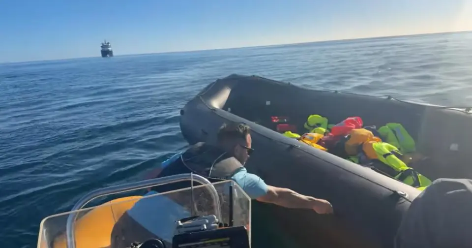 Police probe footage of man stabbing migrant dinghy in English Channel