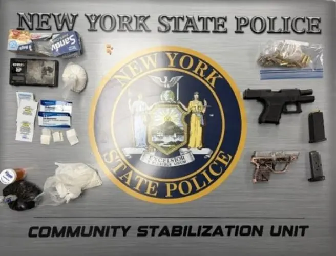 Two Syracuse men arrested in drug and weapons raid on Schiller Avenue