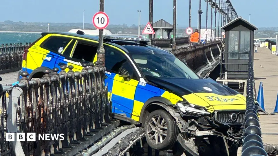 Police car ploughs through Ryde Pier railings during assault inquiry, two rescued
